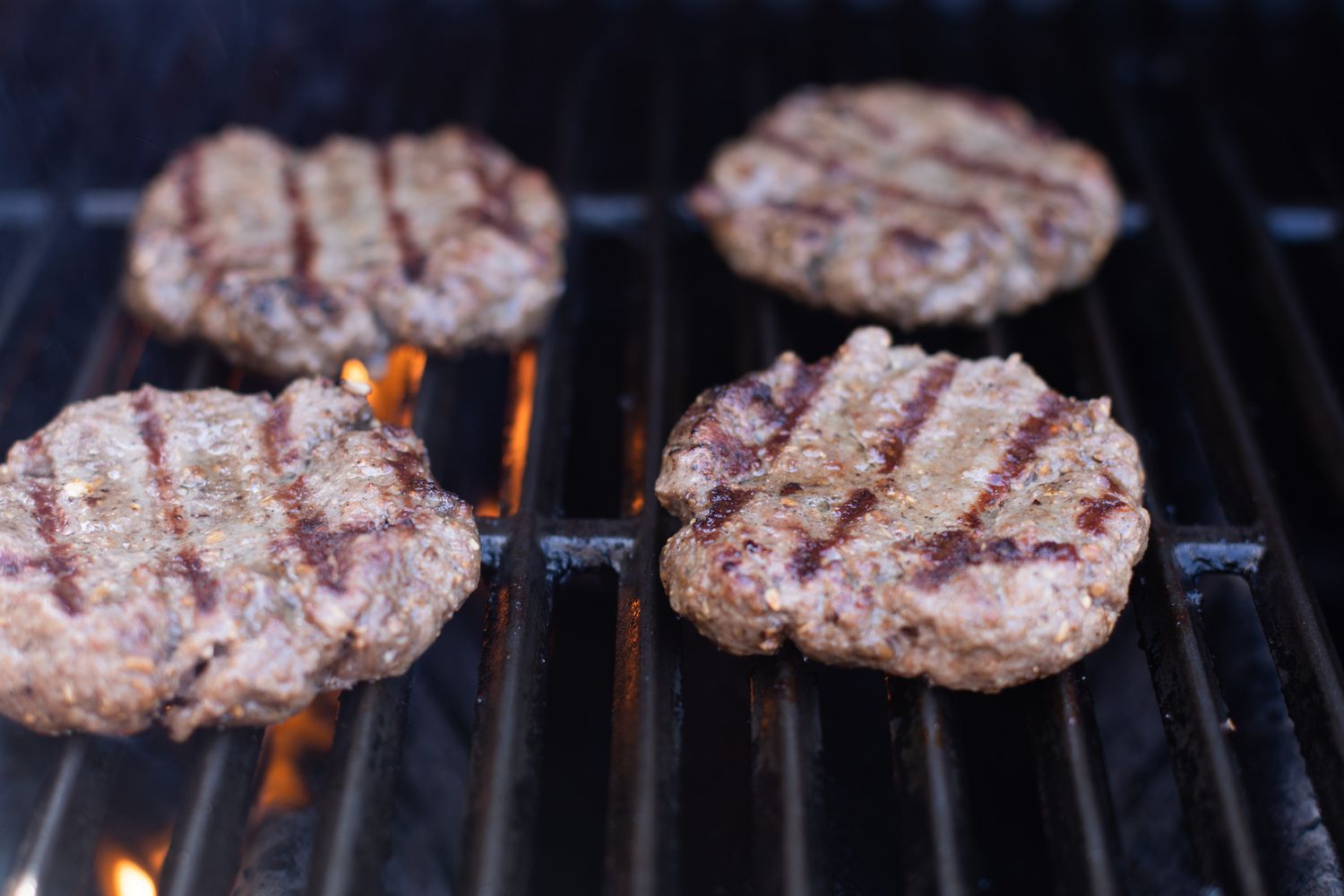 Grilling mushroom swiss burgers.