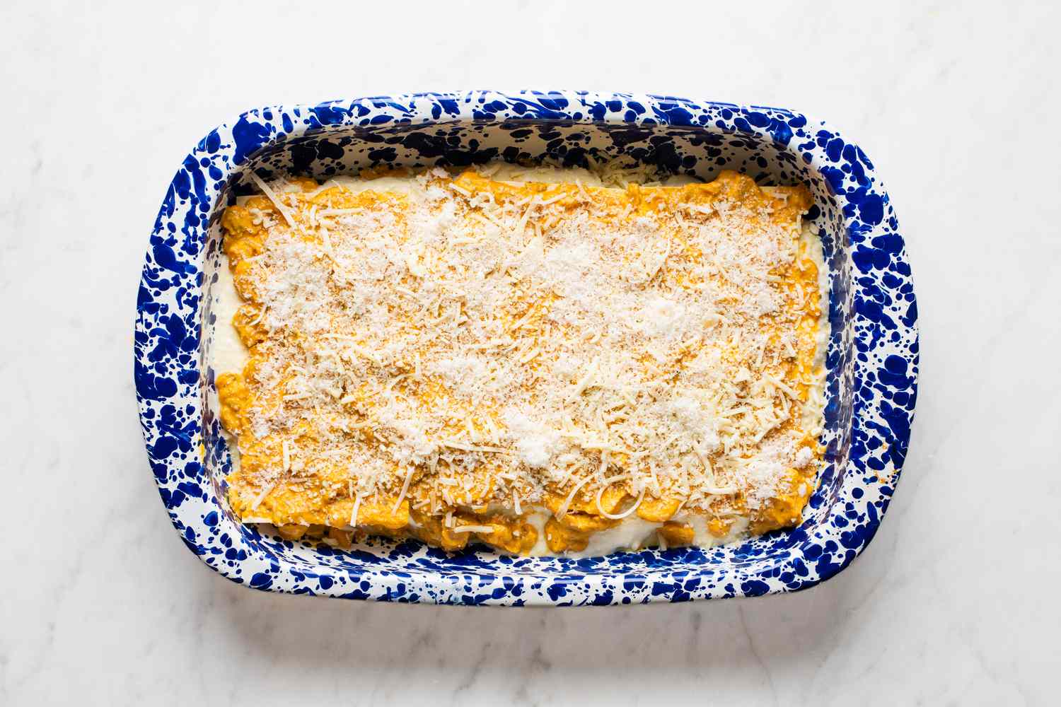 Overhead view of uncooked layered Easy Pumpkin Lasagna