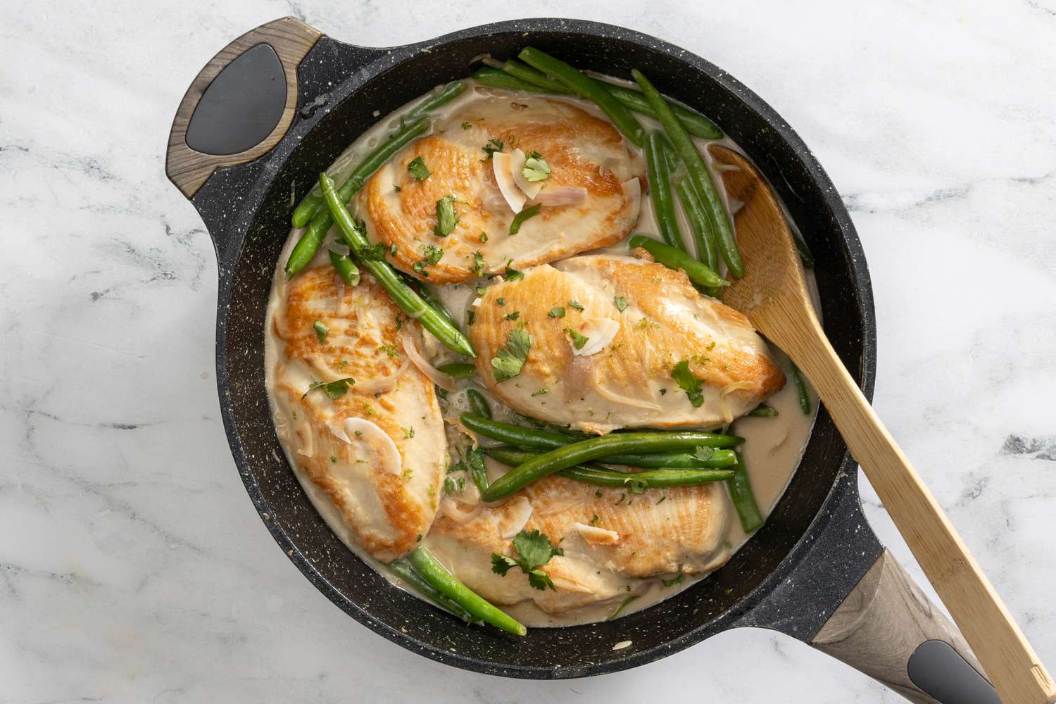 creamy coconut chicken topped with some cilantro