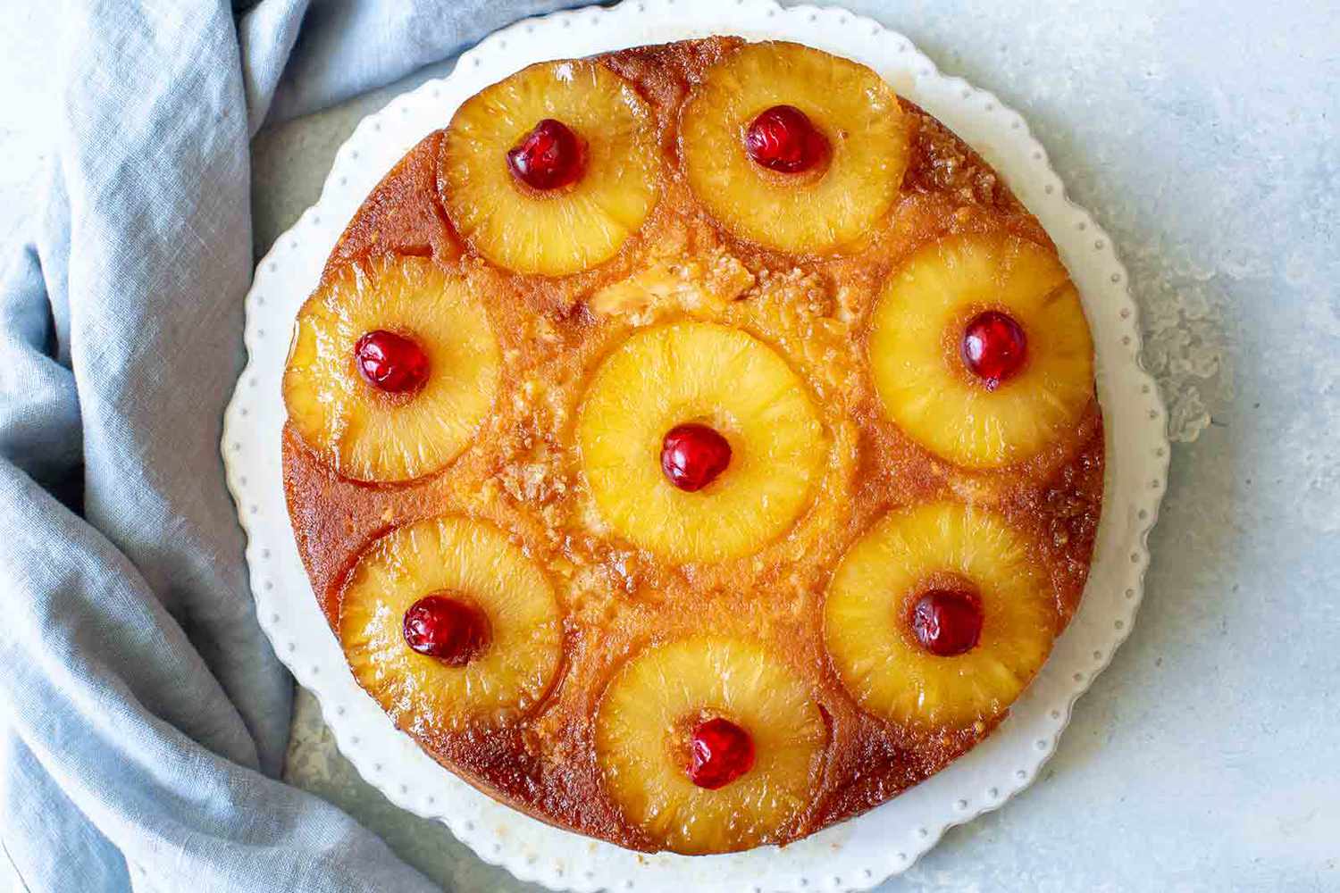 Pineapple Upside Down Cake in pan with cherries