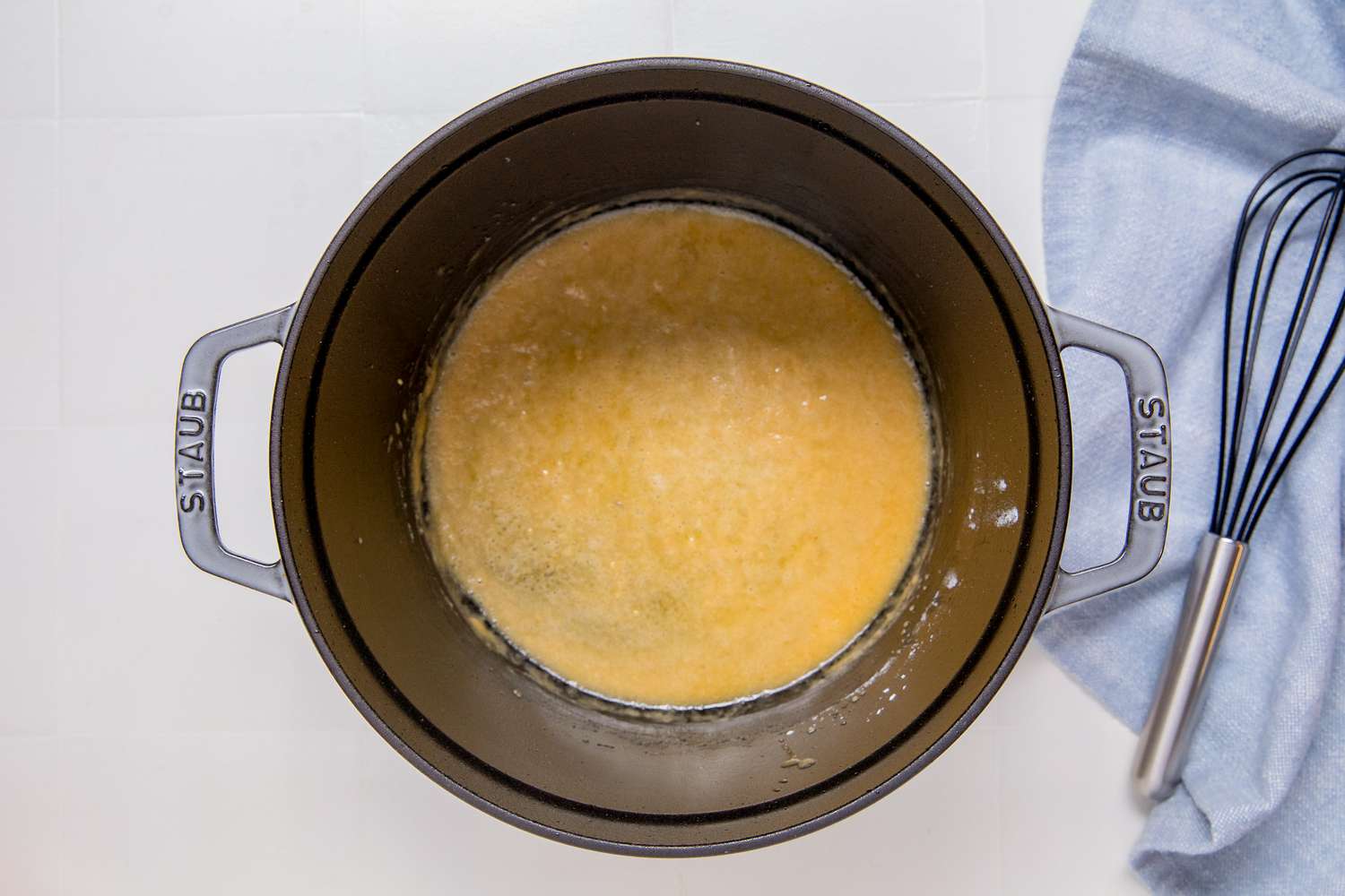 Overhead view of oil and butter added to a saucepan for Marry Me Chicken Casserole recipe