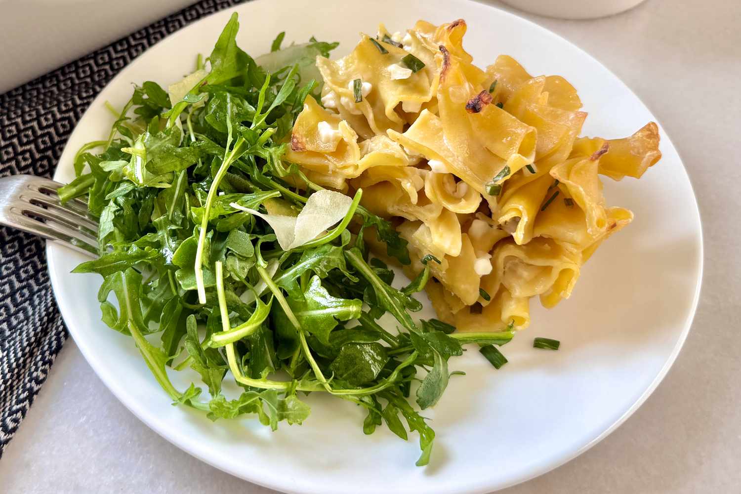 plate of Jackie Kennedy's 4-ingredient Casserole with a mixed green salad