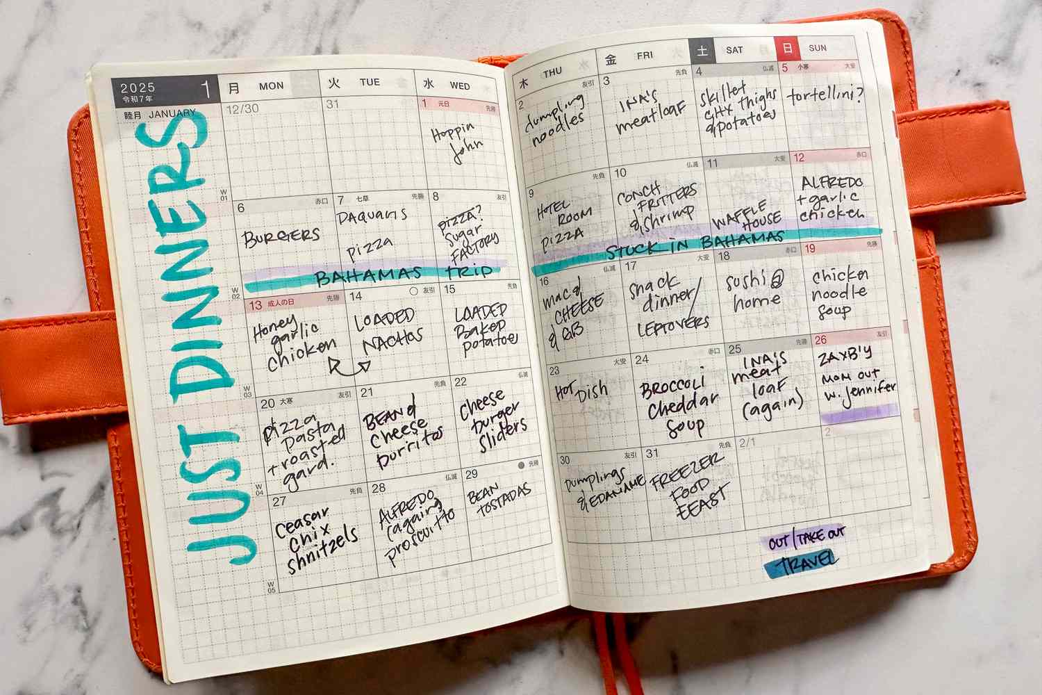 An open meal planning journal with handwritten dinner entries