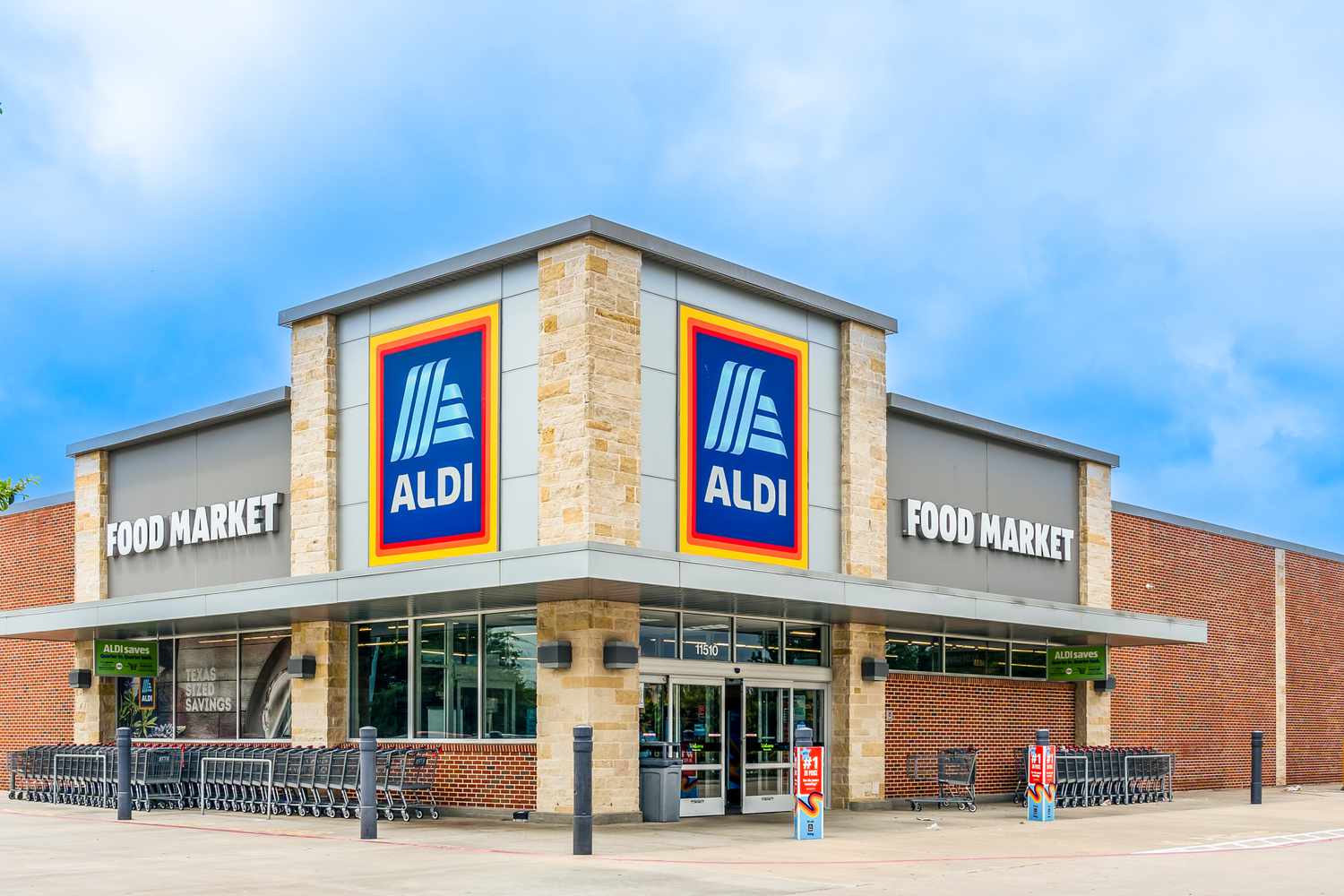 Front exterior view of an Aldi grocery store with its logo prominently displayed