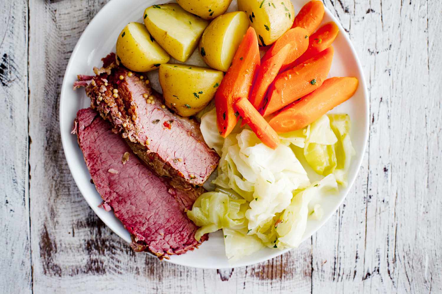 Insta Pot Corned Beef - corned beef, cabbage, potato, carrots on plate