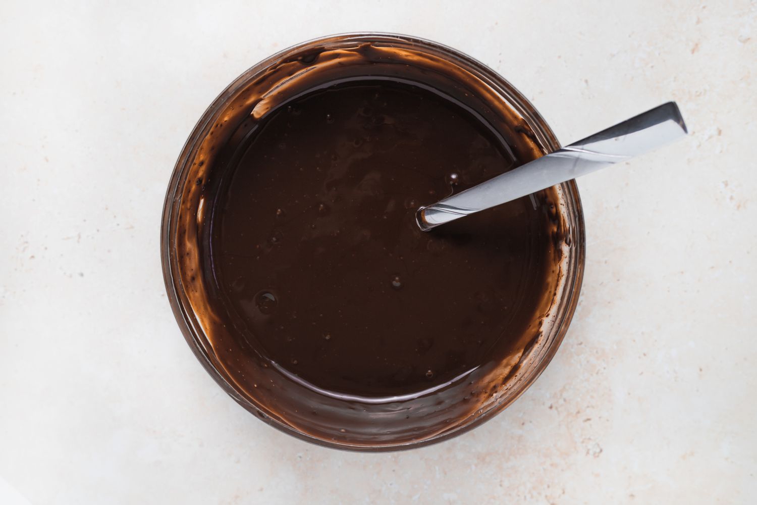 Ganache in a bowl to fill chocolate macarons.