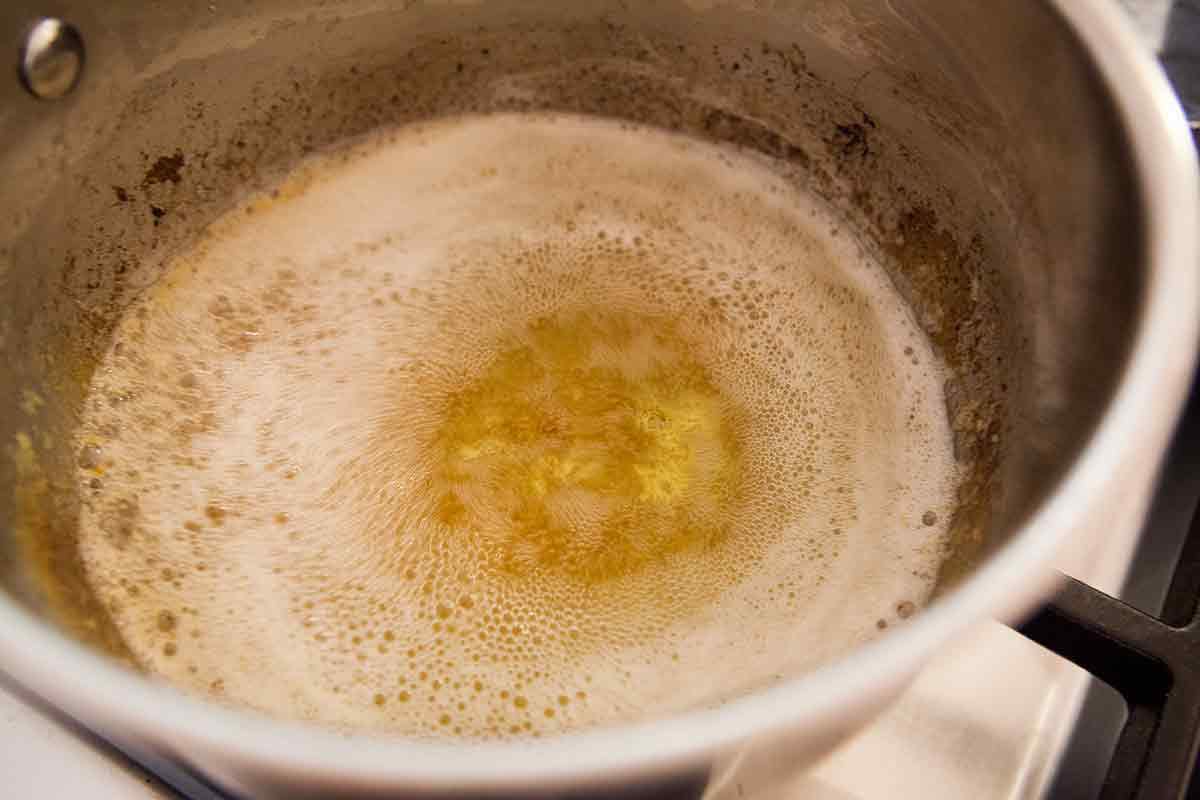 Once the butter for chocolate chip oatmeal cookies has browned, the butter solids will sink to the bottom and the butter will smell nutty
