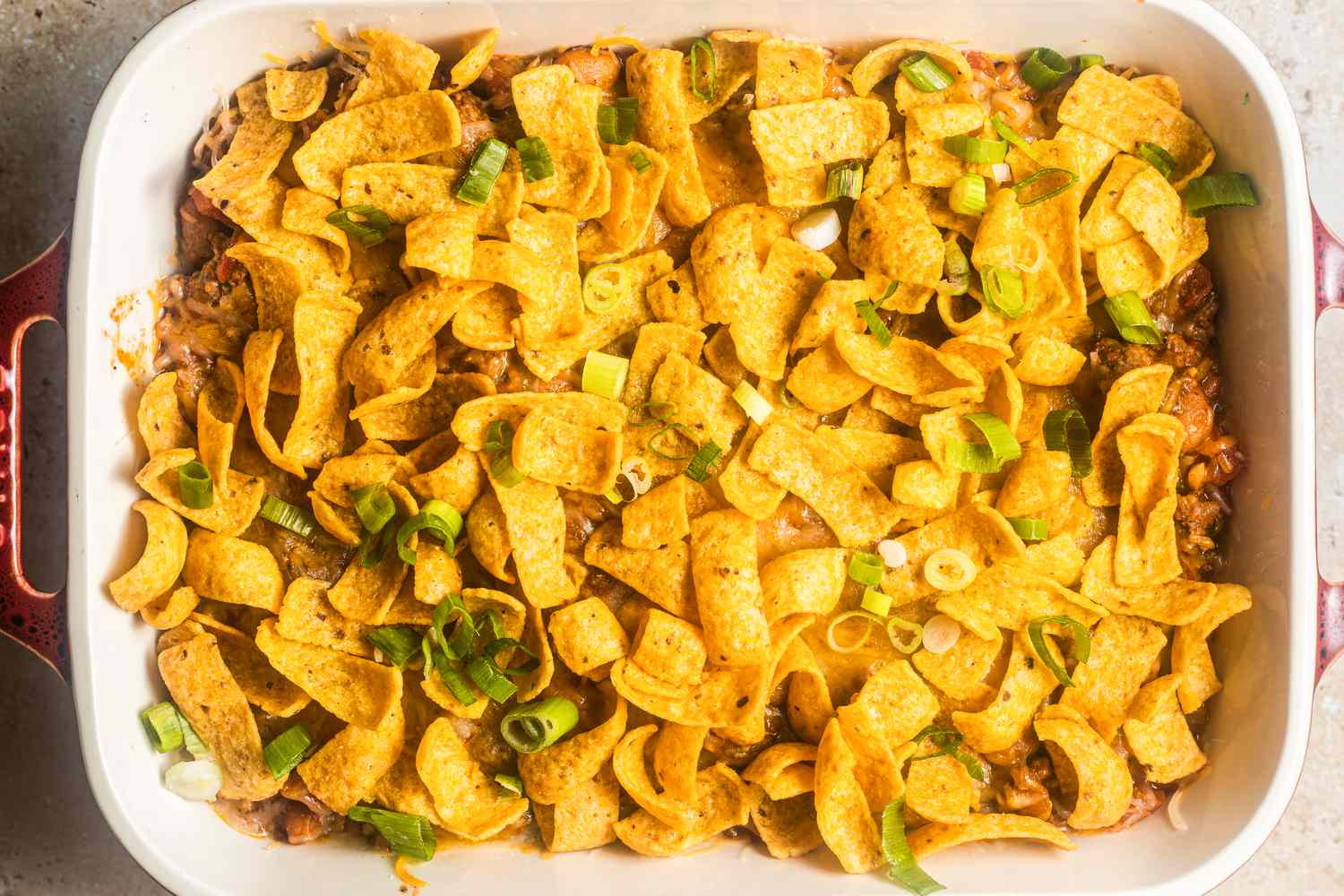 Walking taco casserole topped with Fritos chips (casserole uncooked)