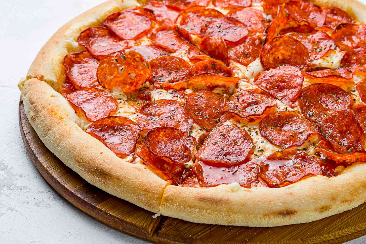 A close up of a pepperoni pizza