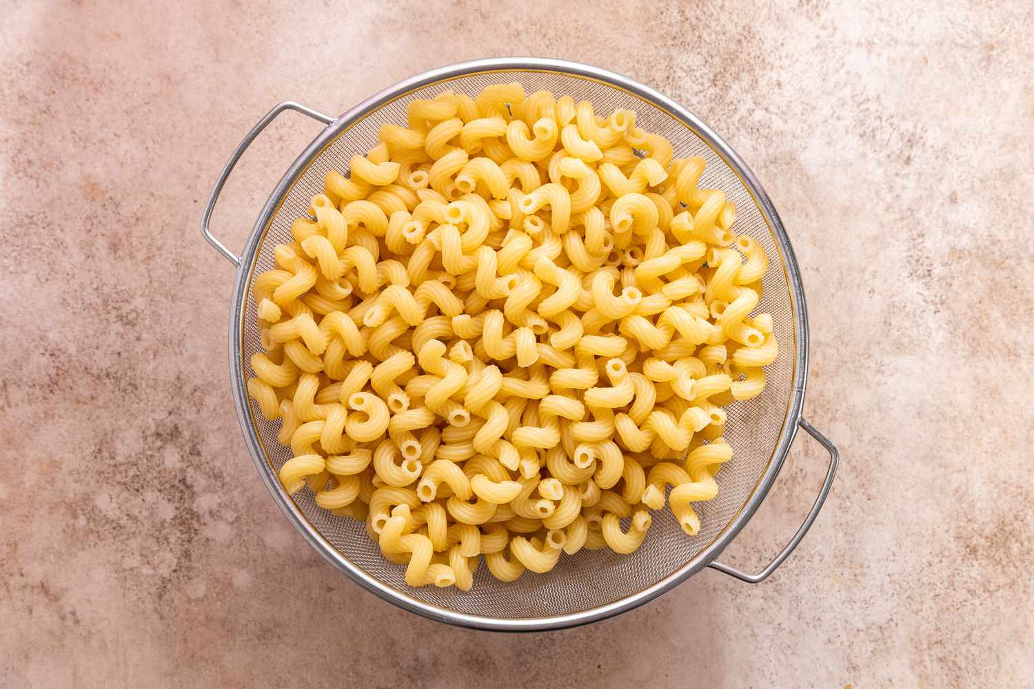 Cooke Cavatappi in the Same Colander With the Peas