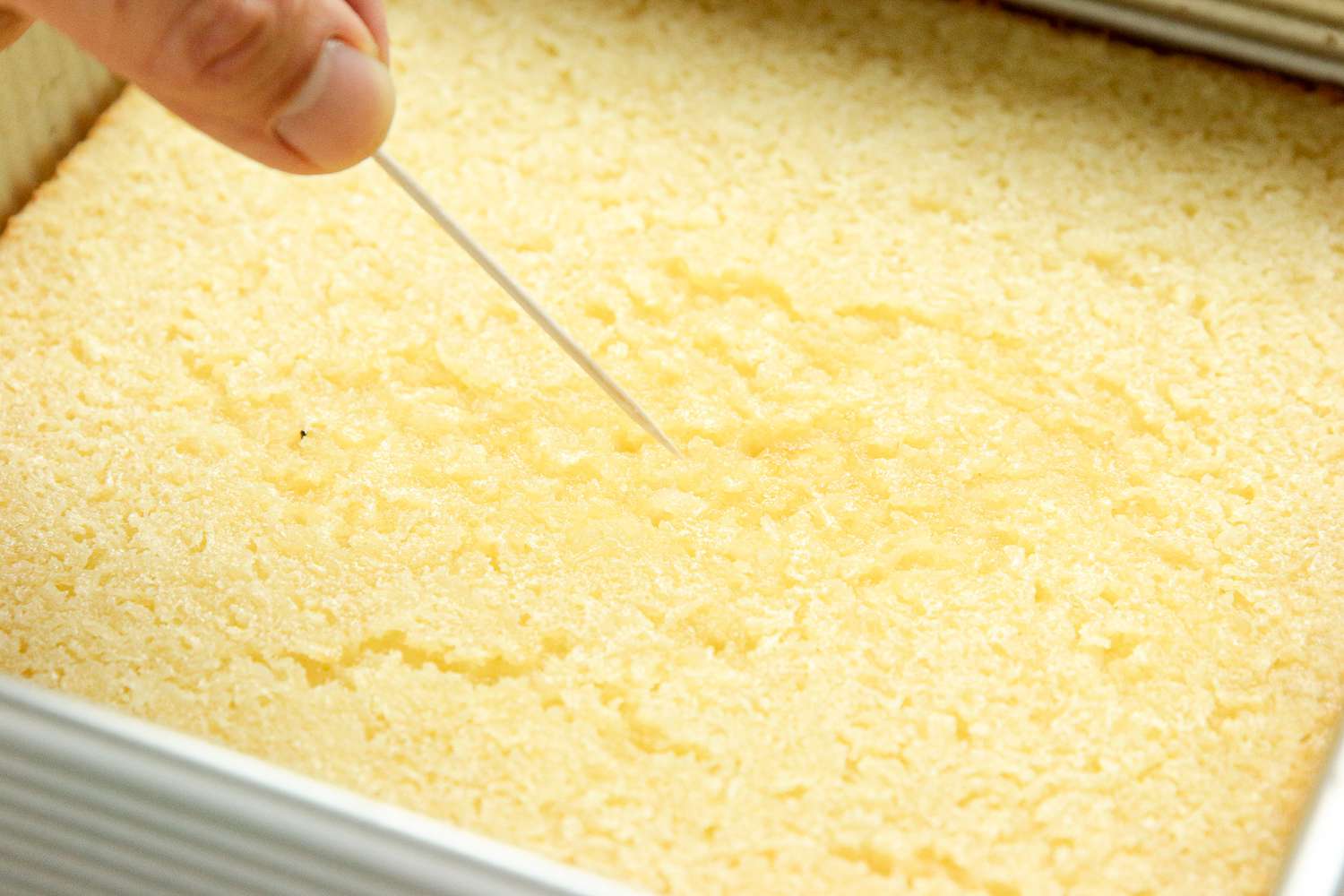 Toothpick Inserted into Cassava Cake to Check If Ready