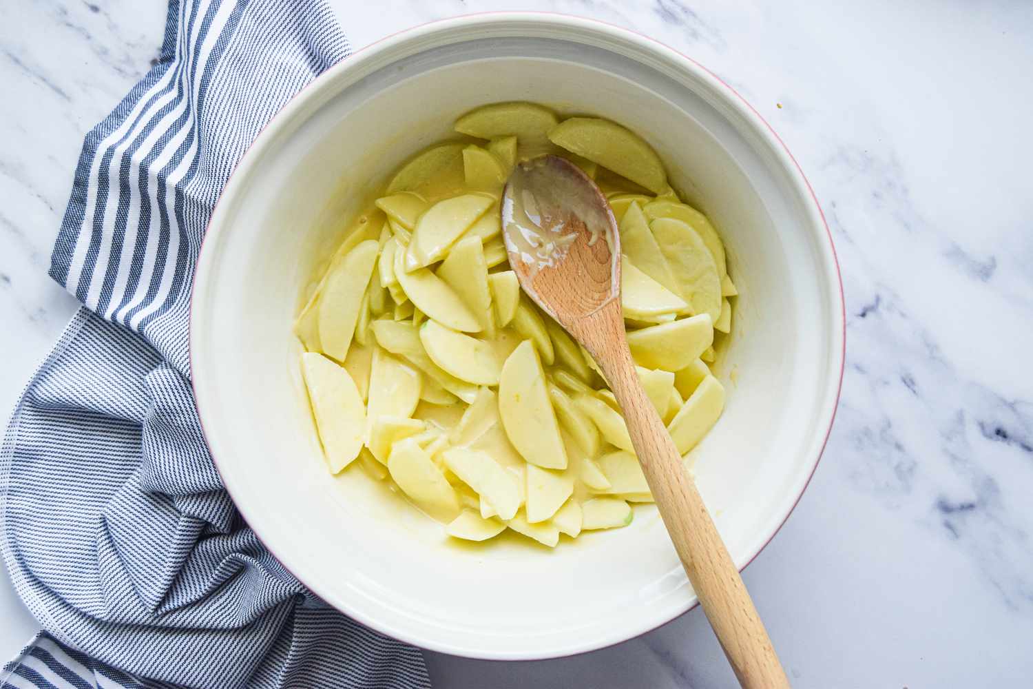 Mix Apples and Wet Ingredients for Apple Pie Recipe