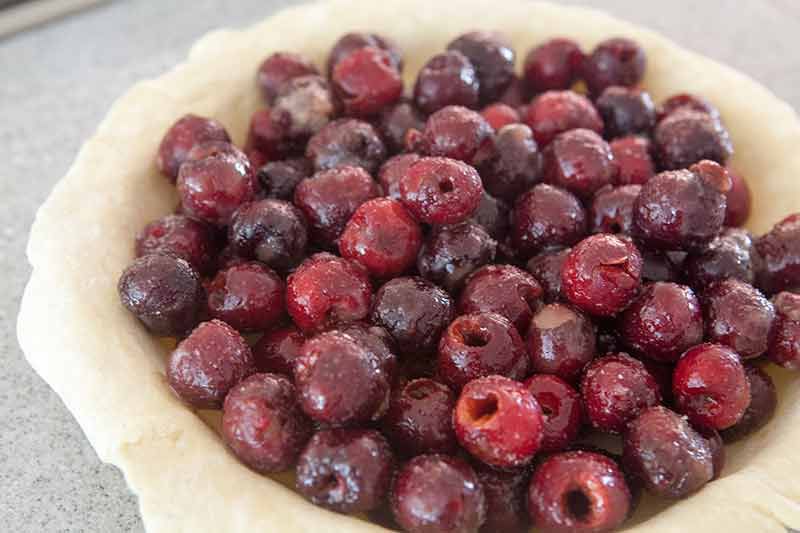 How to make cherry pie by using a homemade crust and filling it with cherry pie filling.