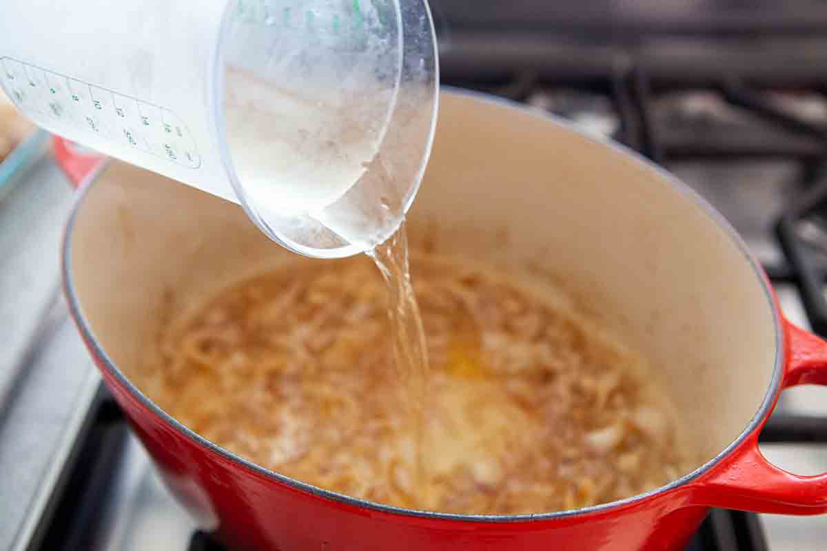 deglaze pan with white wine over shallots