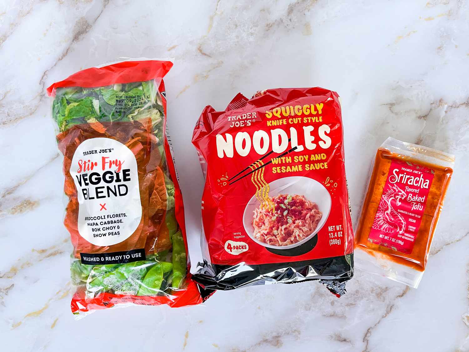 stir-fry ingredients: stir-fry veggie blends, knife cut noodles, and sriracha tofu