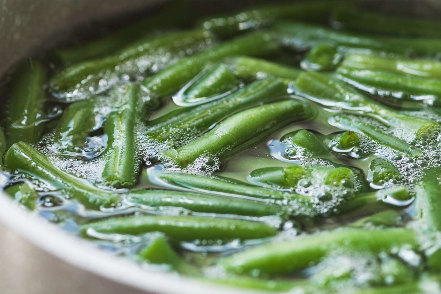 Blanching green beans to make a nicoise salad recipe.