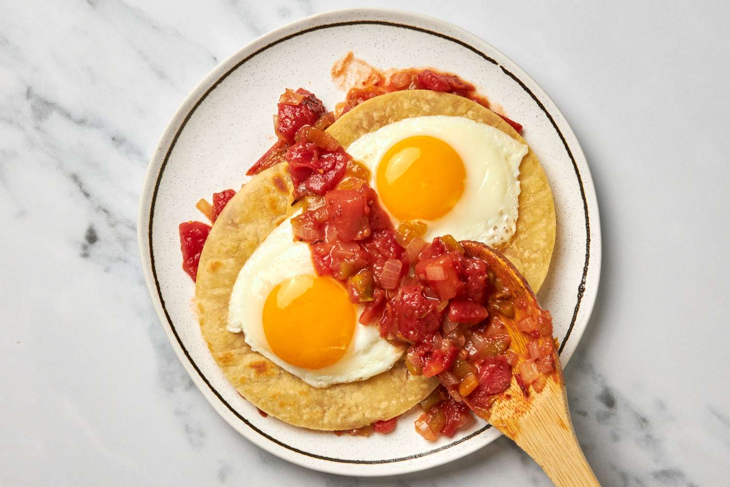 Eggs and More Salsa Added to the Tortillas