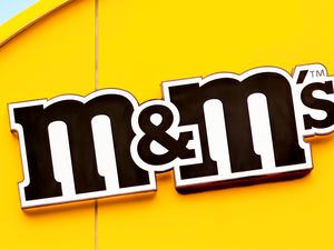 The MMs logo on a yellow background