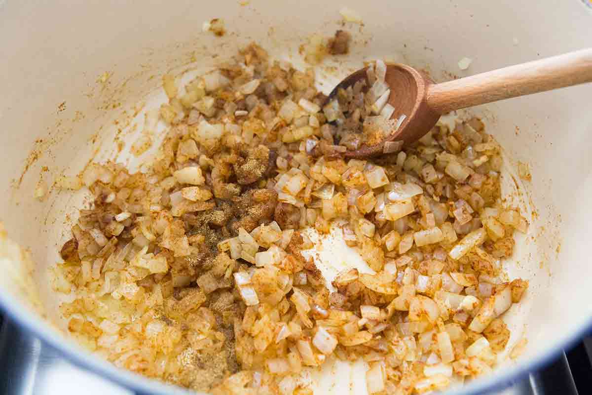 add smoked paprika and cumin to onions and garlic