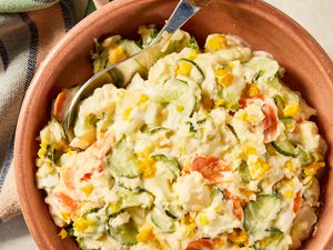 Korean-style potato salad in a bowl next to a table napkin