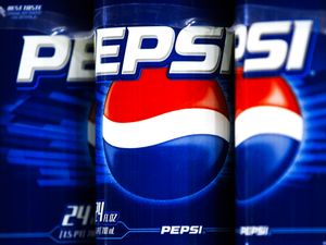 Pepsi soda cans with closeup view of branding and logo arranged side by side