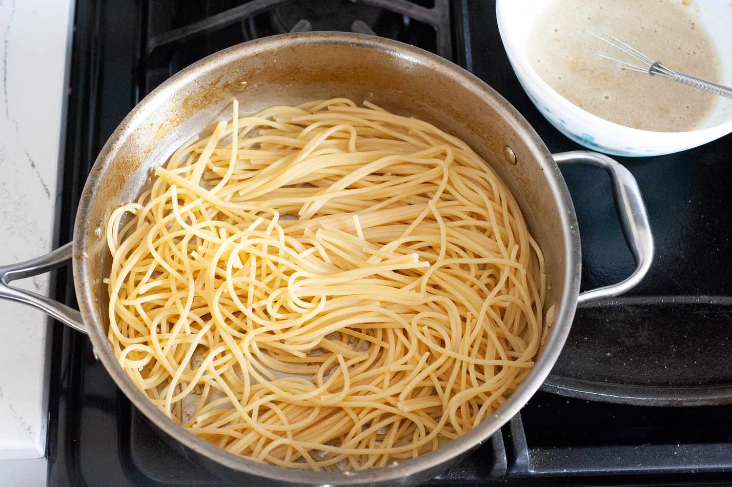 Cook spaghetti for chicken carbonara