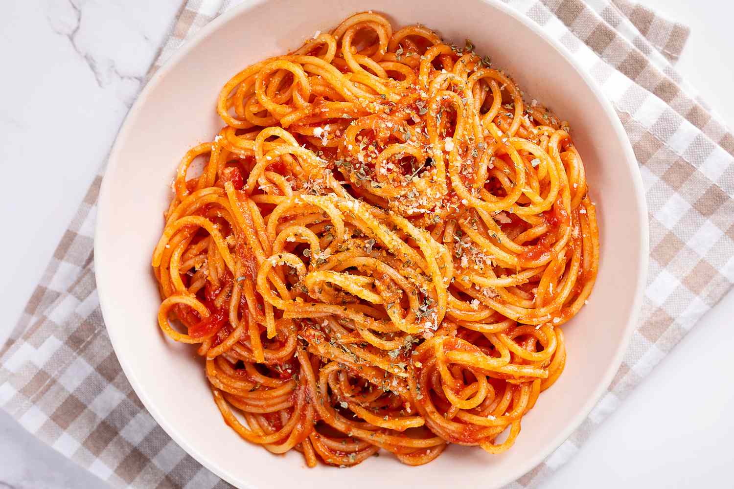 A dish of spaghetti in red sauce