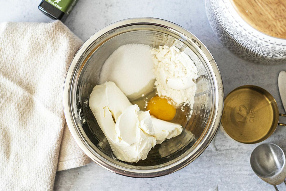 Overhead view of cream cheese filling in a bowl to make cream cheese stuffed banana bread.