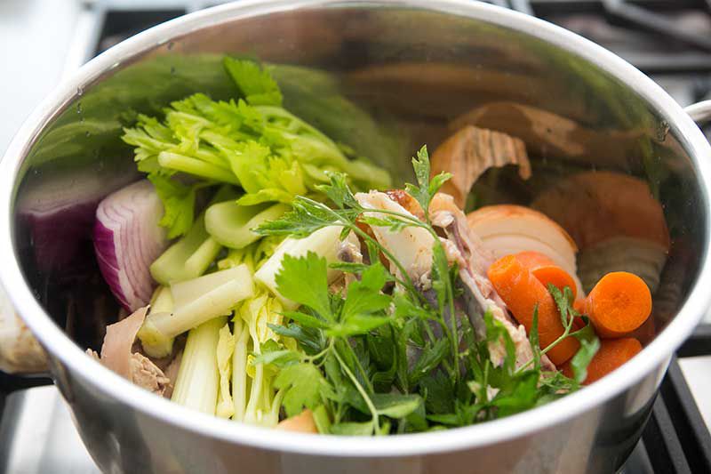 Chicken stock ingredients in a stock pot