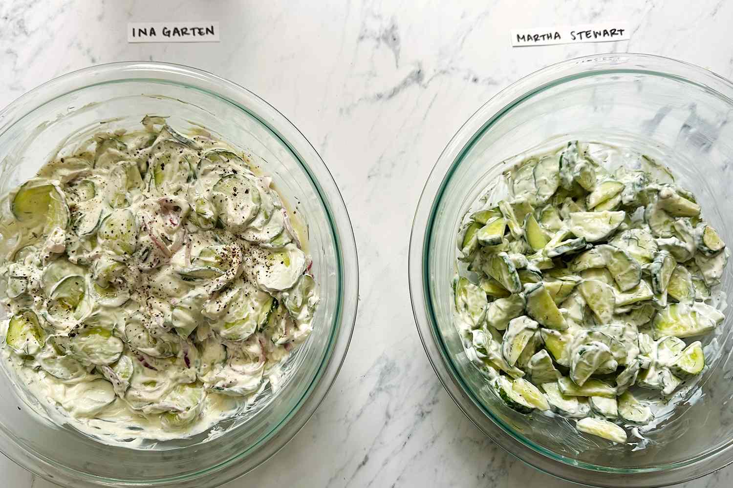 Two bowls of cucumber salad one labeled Ina Garten and the other labeled Martha Stewart