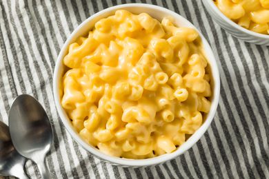A close-up photo of yellow mac and cheese in a bowl