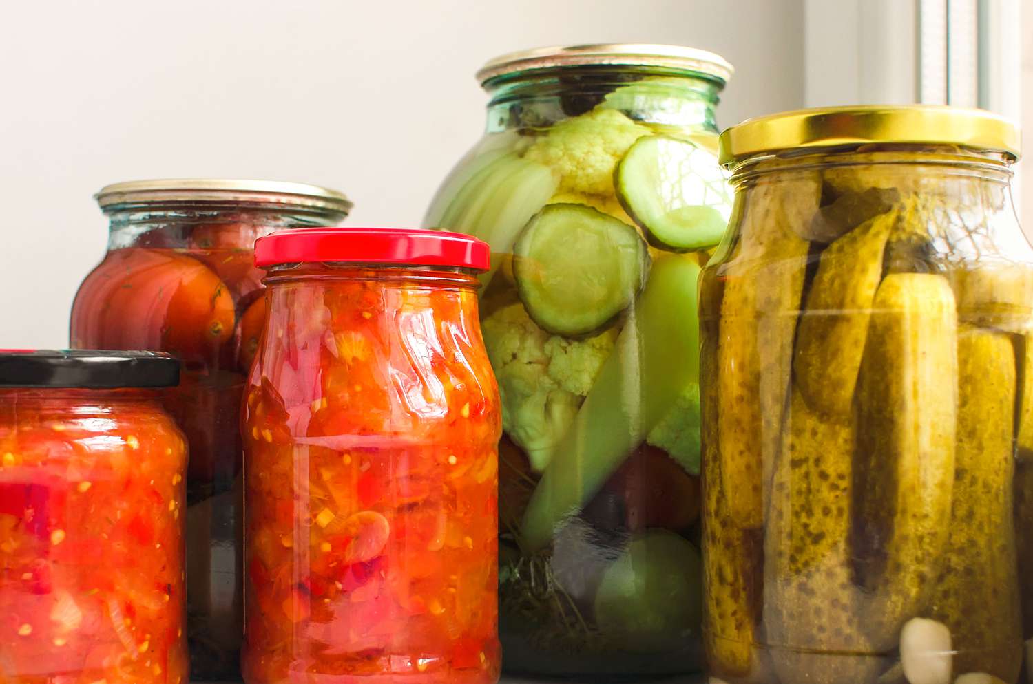 various jars of pickles and pickled veggies