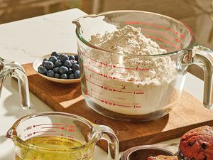 Measuring cup on a cutting board