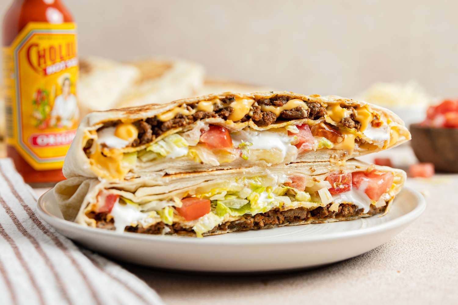Copycat Crunchwrap Supreme Cut in Half on a Plate 