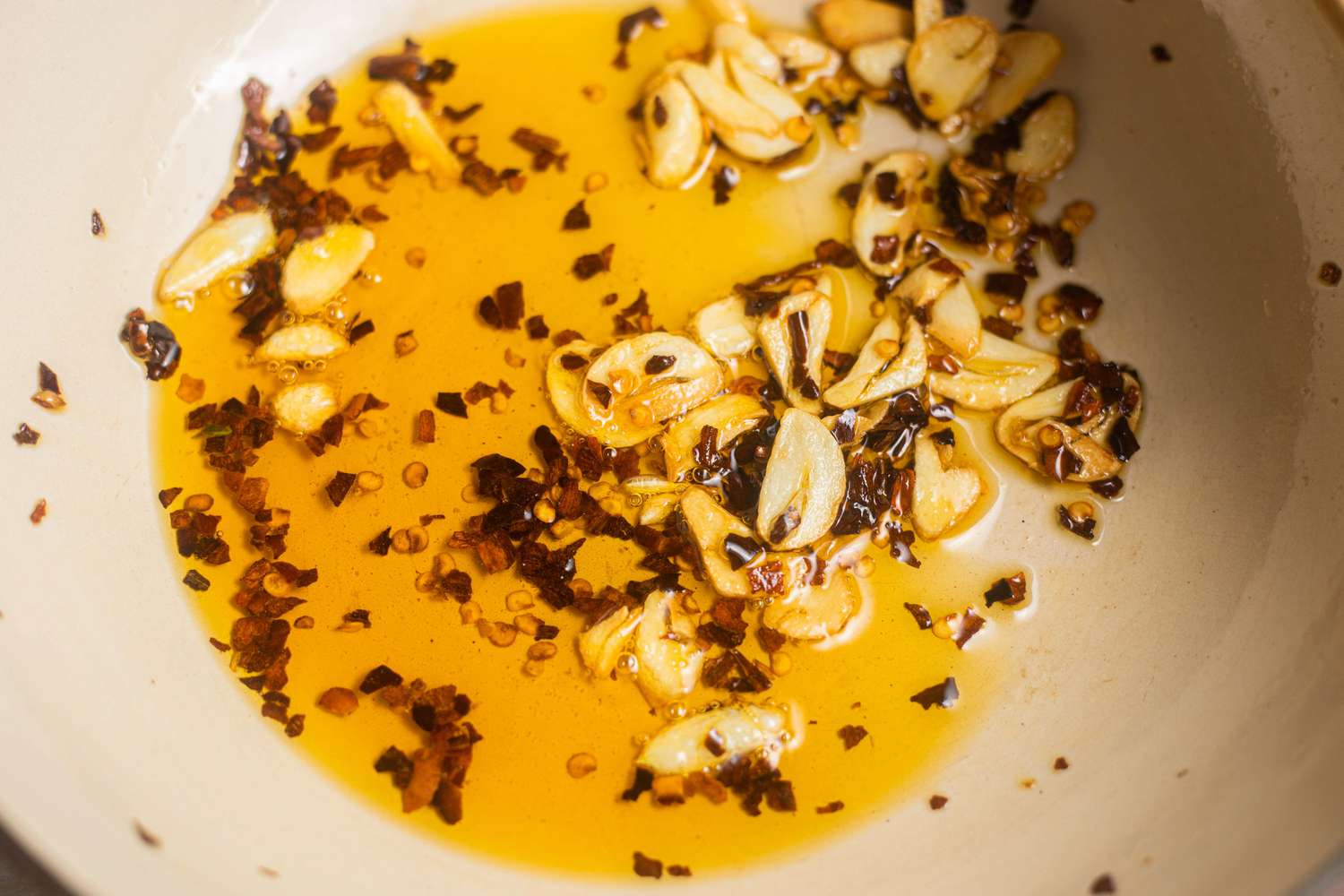 Chili Flakes and Sliced Garlic Sizzling in a Pot With Some Olive Oil for Lemony Sardine Pasta