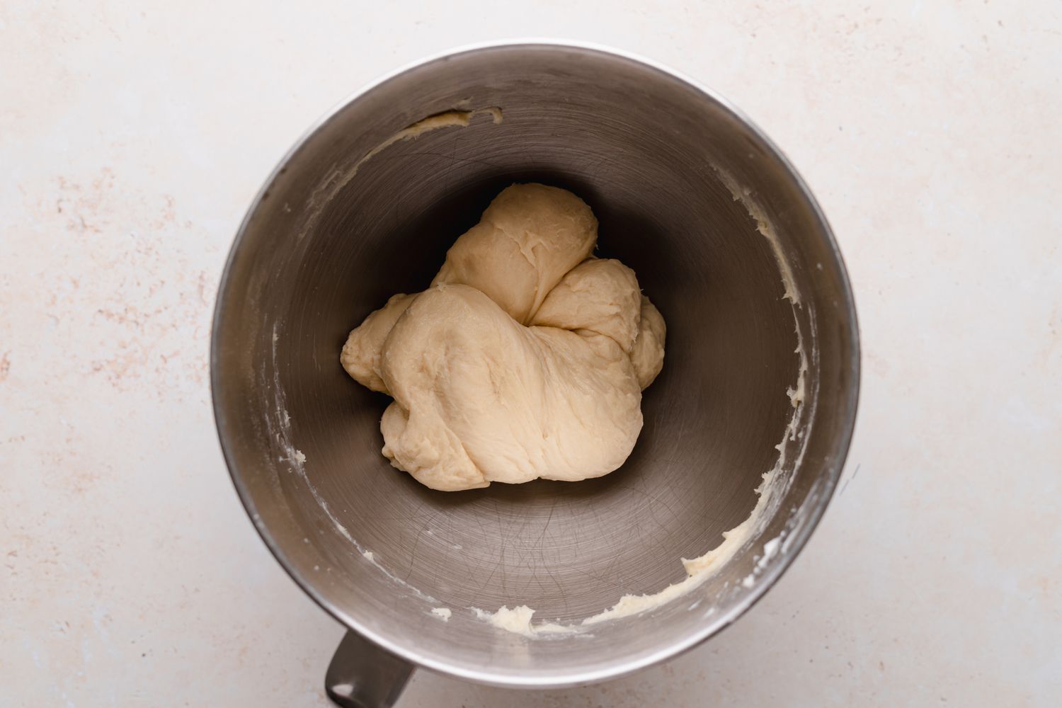 Kneading the dough in a stand mixer to make chocolate loaf bread