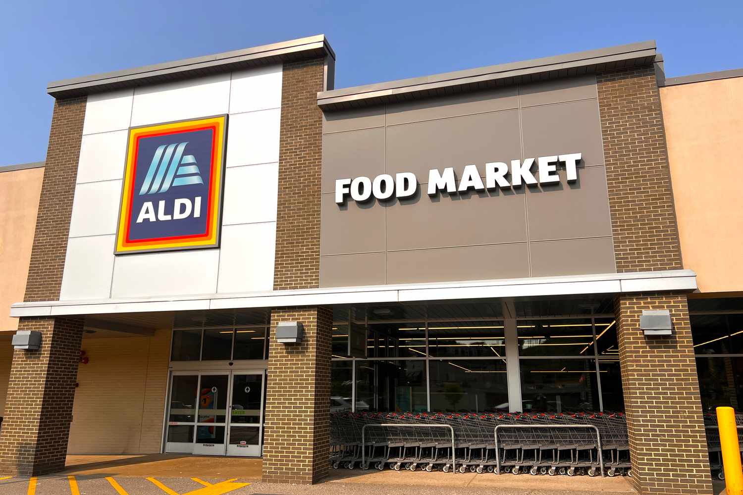 Aldi storefront with a large sign displaying Food Market above the entrance