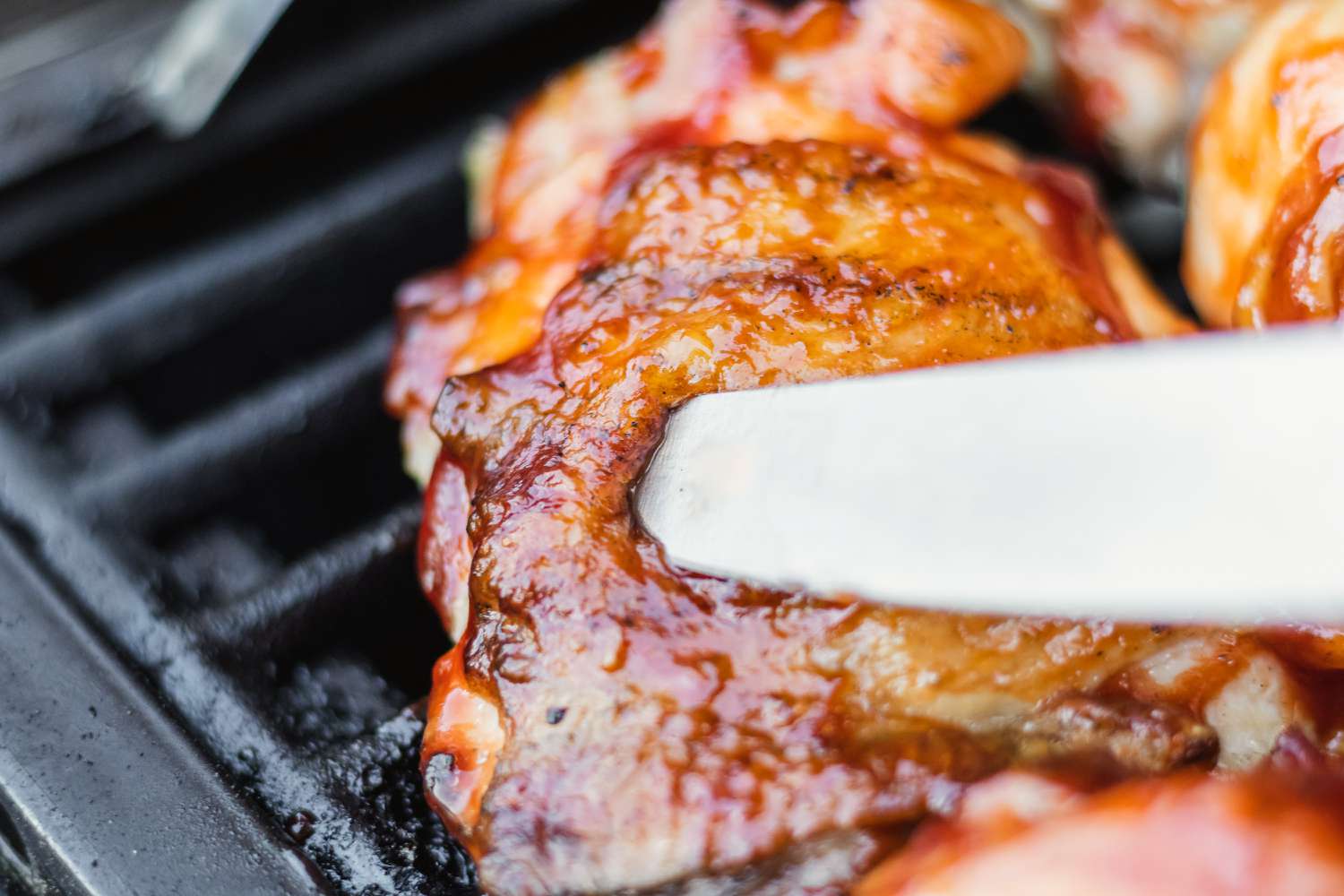 Checking the grilled chicken temperature.