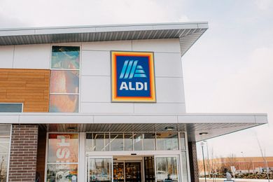 The entrance of an Aldi supermarket with signage above the doors