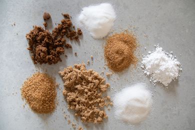 Piles of different kinds of sugar