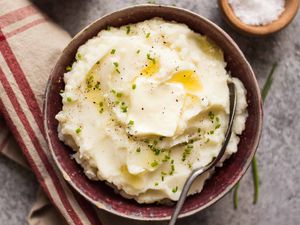 Make Ahead Mashed Potatoes Slow Cooker potatoes in a dish with butter and a napkin