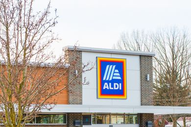 An Aldi store front with its logo displayed prominently on the building