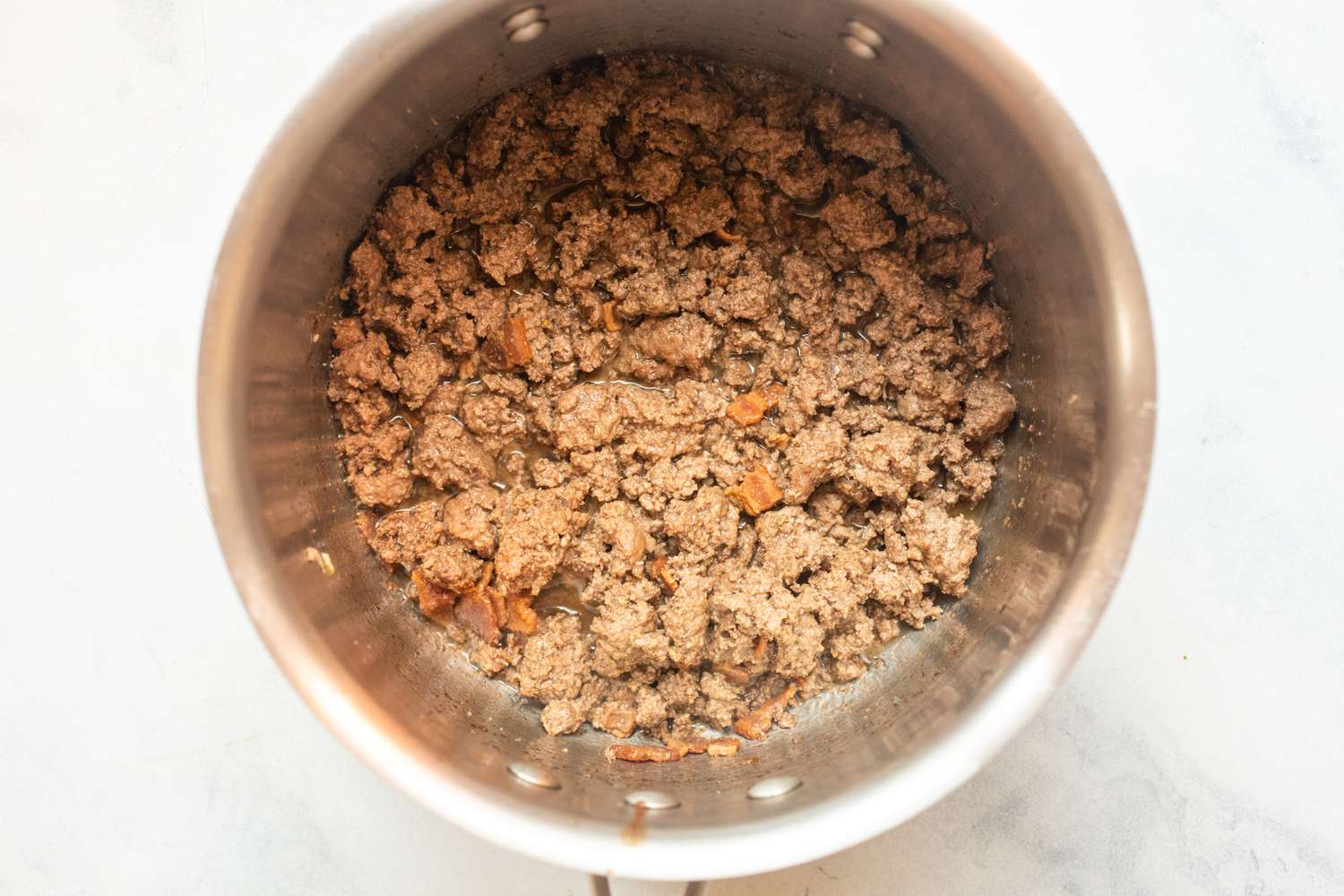 Cook ground beef in pot.