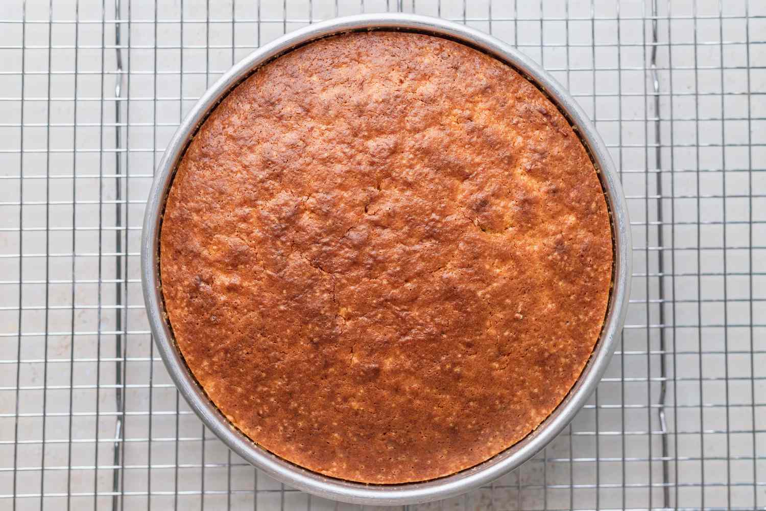 Baked cake in a cake pan.