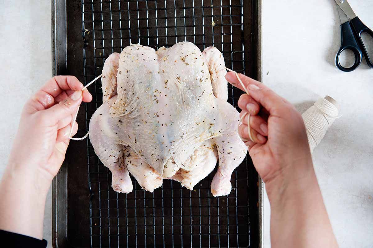 How to Dry Brine a Chicken - trussing a whole chicken