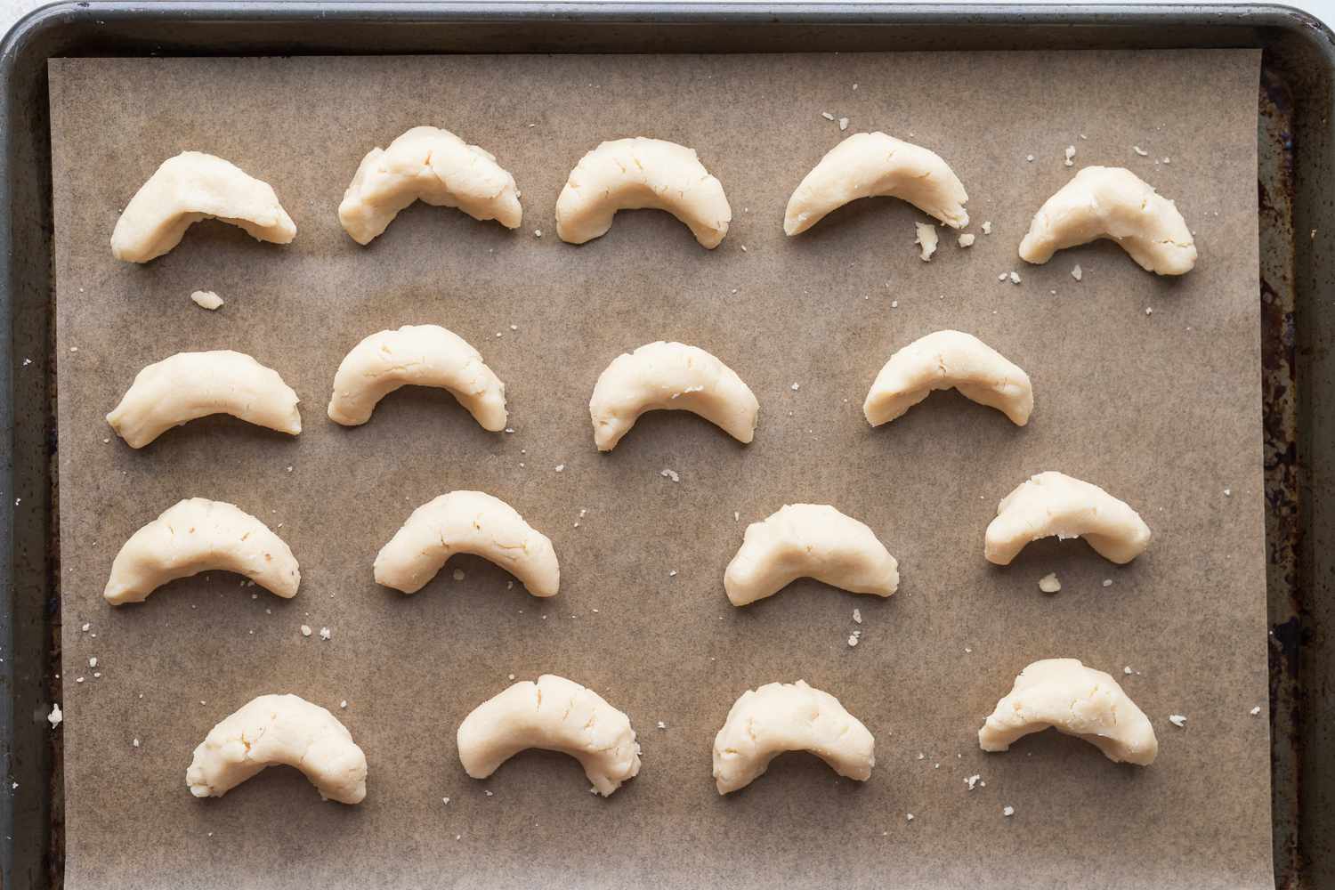 A baking sheet with almond flour sugar cookies ready to be baked.