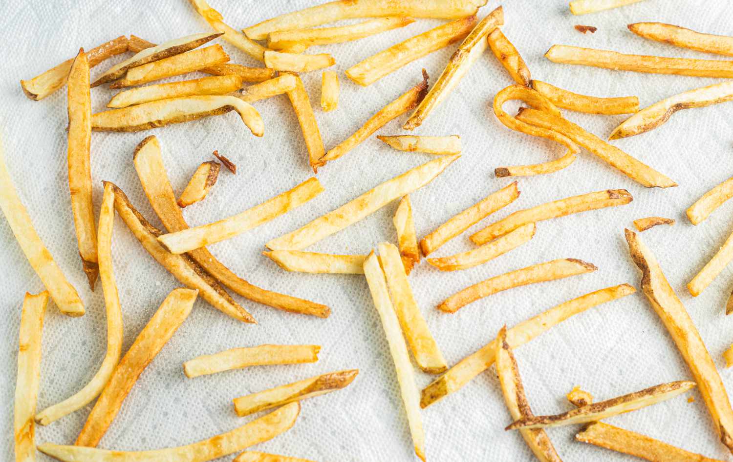 Homemade French Fries Resting on Paper Towels 
