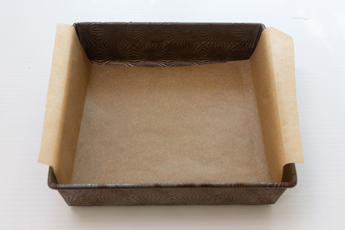 Parchment lined pan to make the best brownie recipe.
