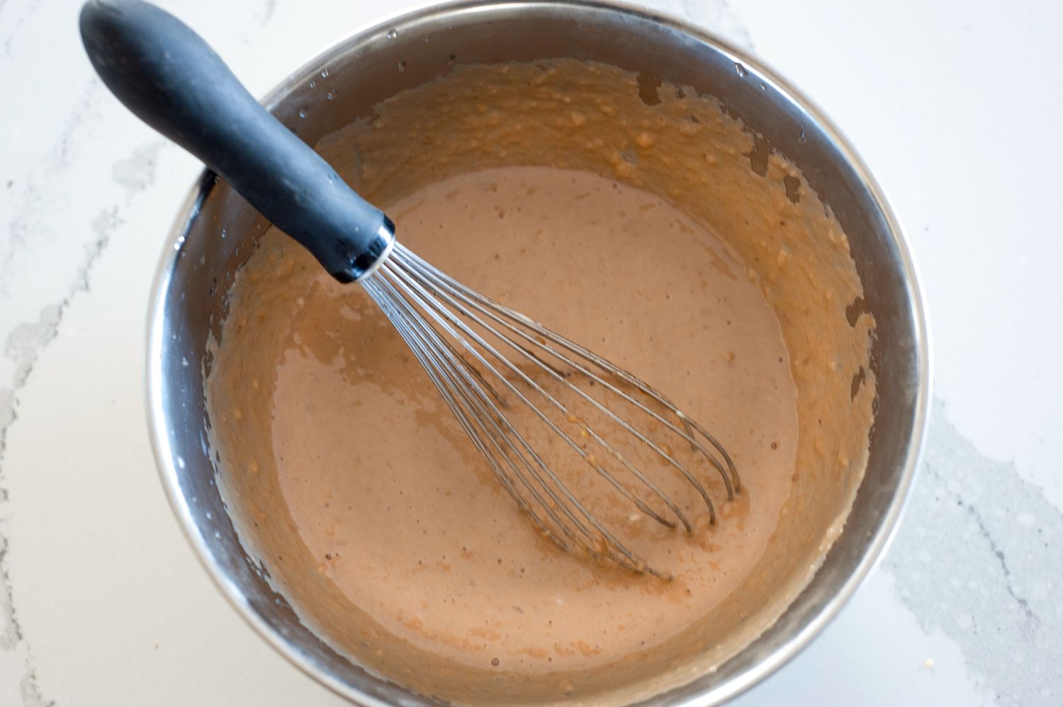 Wet ingredients in a bowl.
