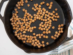 Crispy chickpeas in a black cast iron skillet